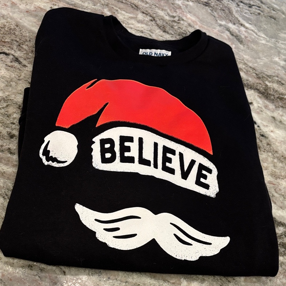 Old Navy Black Sweatshirt with Red Santa Hat and 'Believe' Text
